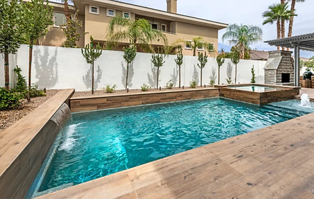 Multi-color decorative pool deck finish around Henderson backyard pool