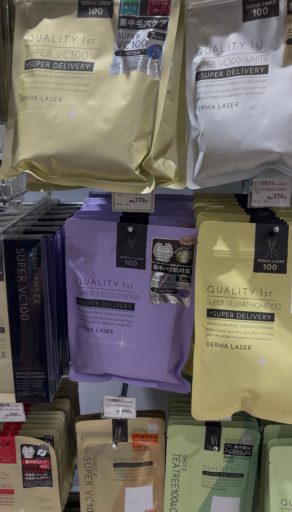 Skincare products on a shelf with colorful packaging in pastel shades. Labels feature "QUALITY 1st" and "DERMA LASER." Price tags visible.