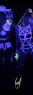 POW and dancers in neon UV body paint and glowing outfits grooving to music