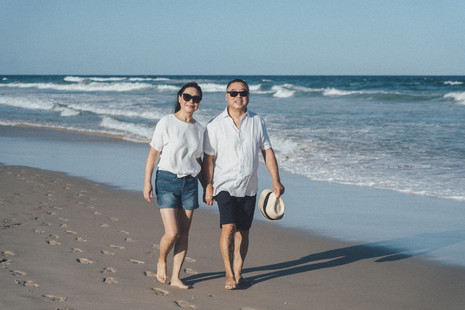 three generation family on a beach