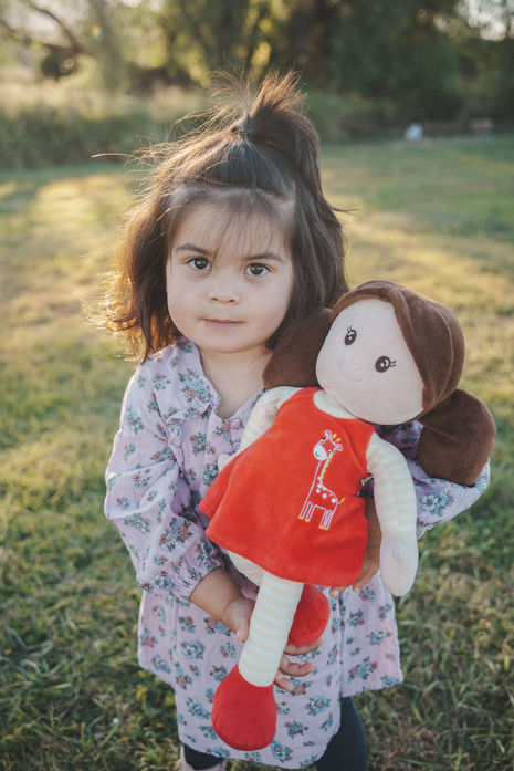 Golden hour family portrait session at Milford Cottages Boonah featuring a multi-generational family in a rustic field.
