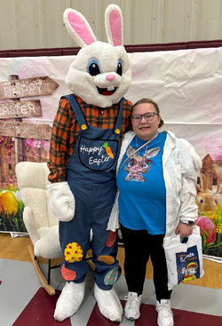An adult lady with the Easter Bunny
