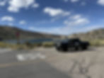 Black pickup truck staged at a lakeside pullout during the Volkswagen shoot in the Eastern Sierra