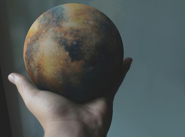 hand holding planet_edited.jpg
