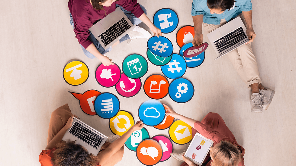 People with laptops surrounded by colorful social media icons. staging-jenschipper