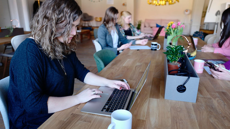 Woman sitting at laptop in coworking space