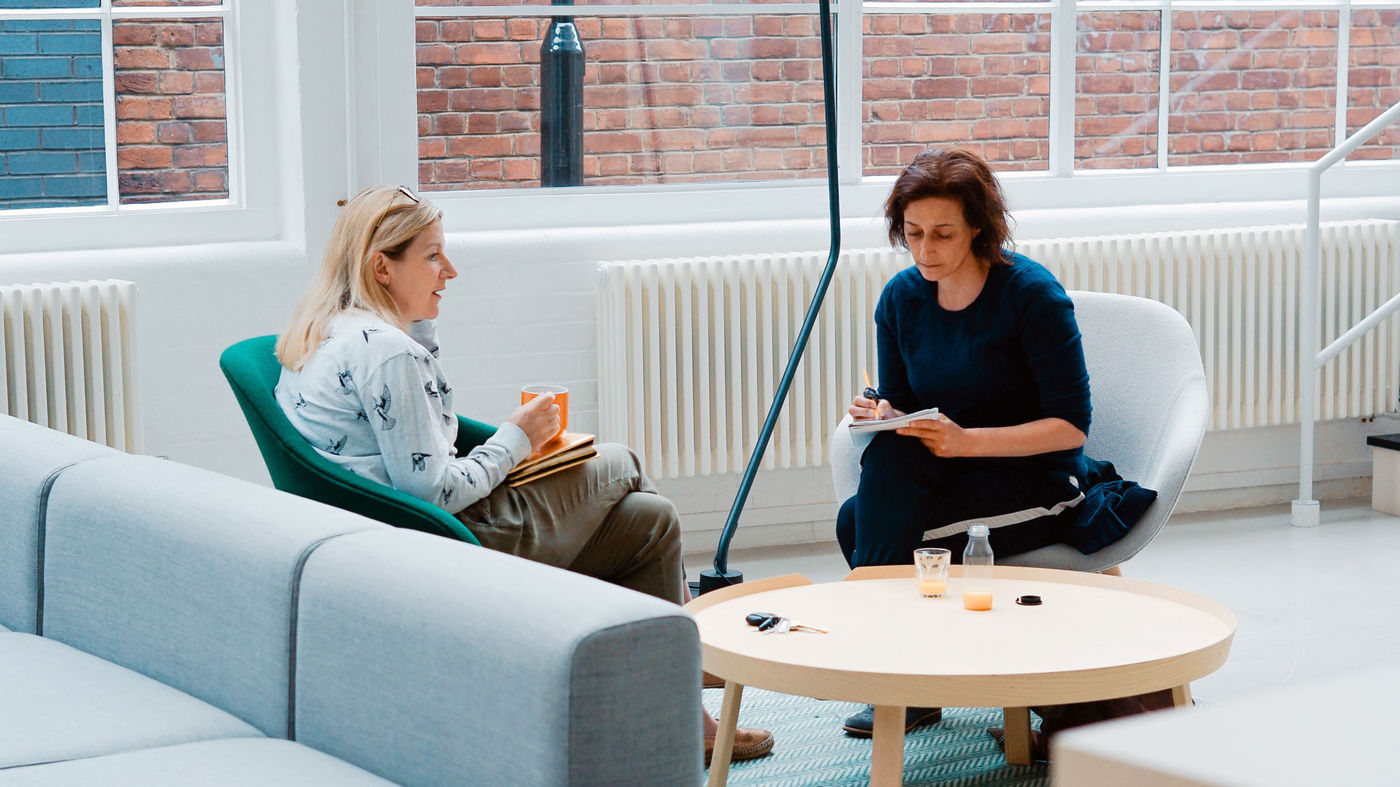 Women sitting at a table and talking