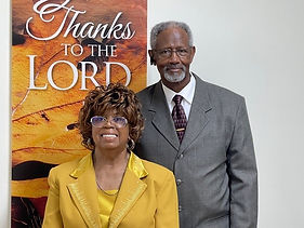Pastor and Dea Minter - Gold suit.jpg
