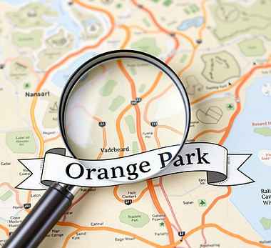 background of road map; magnifying glass; banner with _Orange Park_.jpg