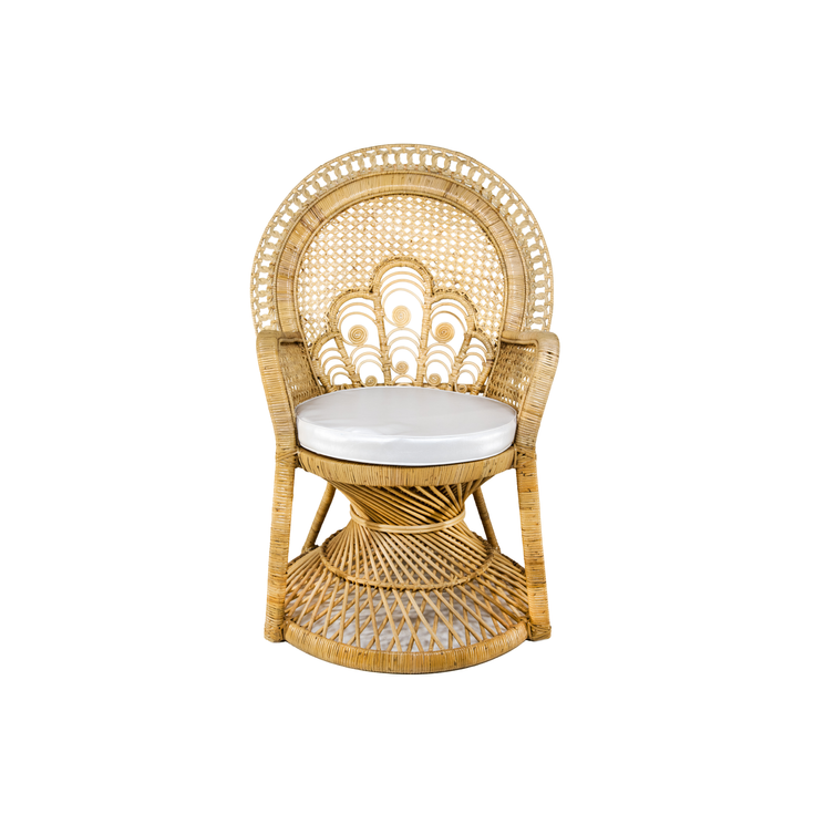 Natural rattan peacock chair with an ornate woven fan back, sculptural base, and white seat cushion.
