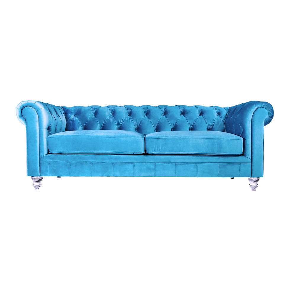 Azure blue velvet sofa with deep button tufting, rolled arms, plush cushions, and turned silver legs.