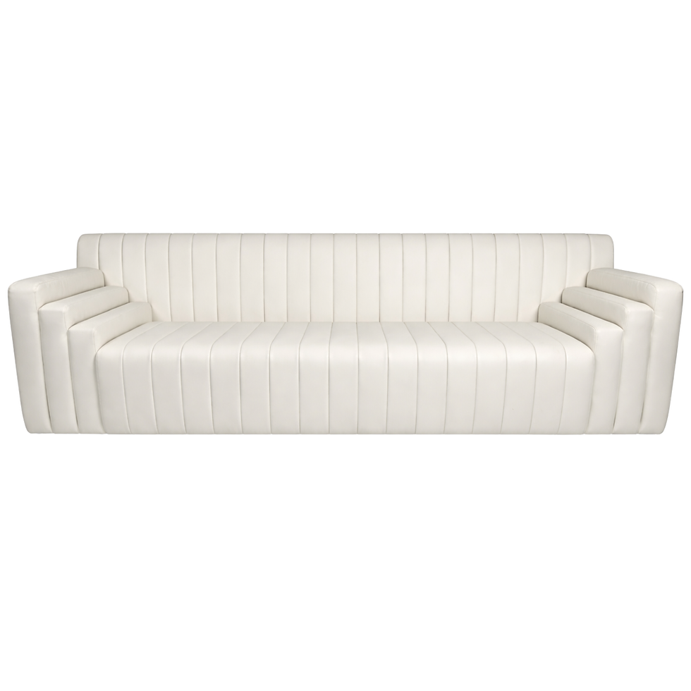 White leather sofa with vertical channel tufting and a modern silhouette for luxury event lounges.