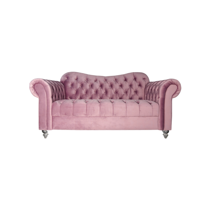 Dusty rose velvet Chesterfield loveseat with deep button tufting and rolled arms for luxury event lounges.