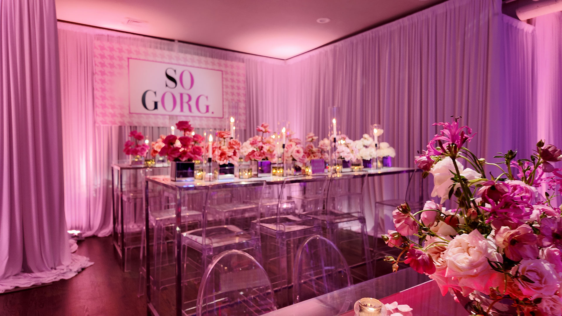 So Gorg fashion themed Bat Mitzvah table design with pink florals, candles, and draped backdrop at Platform Thirty in Philadelphia