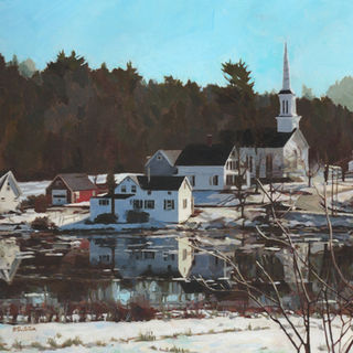 Image of a church by a harbor under a blue sky in wintertime. 