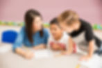 good-looking-preschool-teacher-students-having-good-time-learning-classroom.jpg