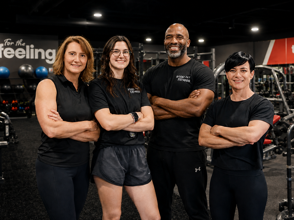 Fitness coaching Newnan GA team smiling in the gym.