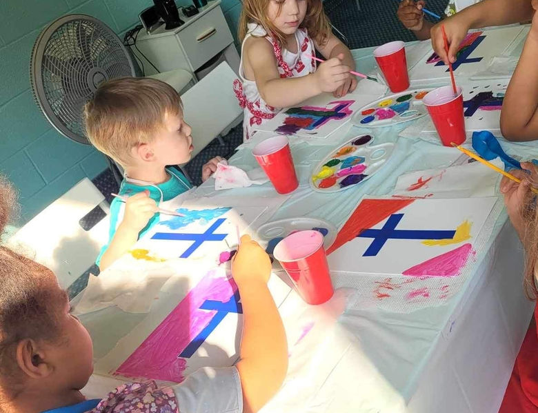 Painting crosses to remind us of Jesus' love