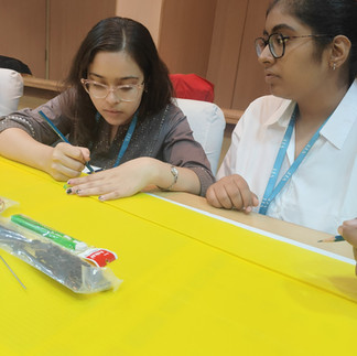 Hands-On Learning: Students Assembling RC Plane Components