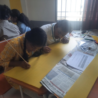 Hands-On Learning: Students Assembling RC Plane Components