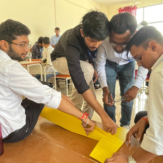 Hands-On Learning: Students Assembling RC Plane Components