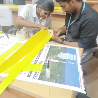 Hands-On Learning: Students Assembling RC Plane Components