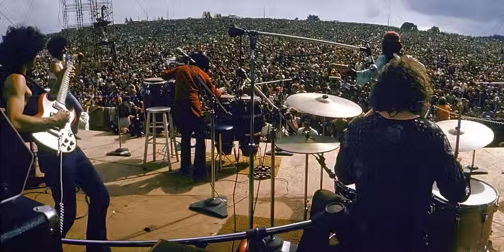 HISTORY.com Editors. “Woodstock.” HISTORY, A&E Television Networks, 9 Mar. 2018, "Members of the Hog Farm Commune Celebrate the Fourth of July, 1968, Aboard Their Bus, the Road Hog." Encyclopaedia Britannica, Encyclopaedia Britannica, Inc.,[Accessed 7 Jun. 2026].