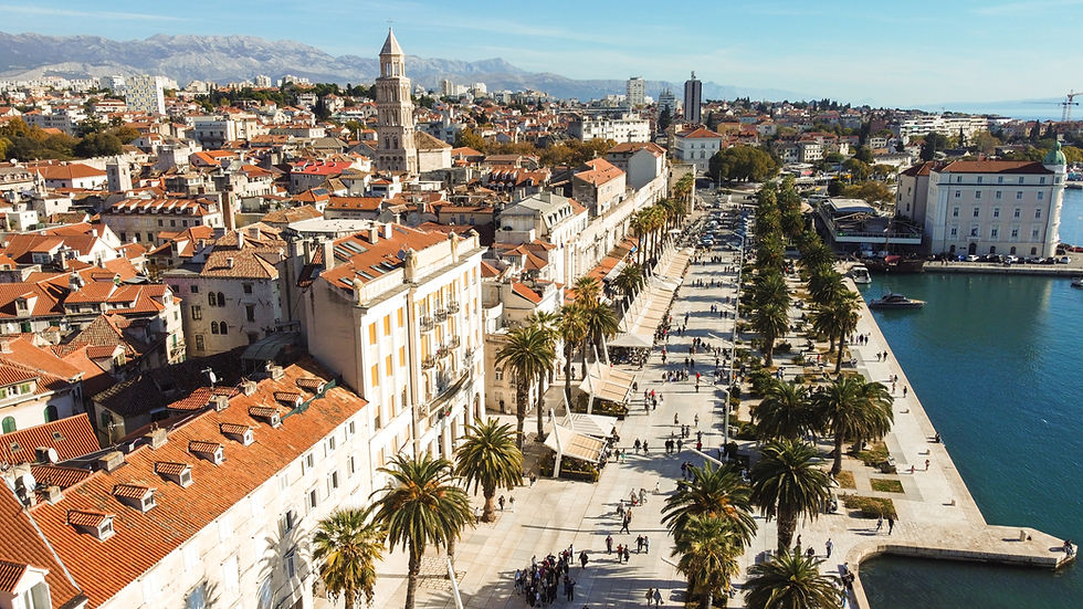 Aerial view of Riva in Split, Croatia, showcasing the bustling waterfront promenade, historic buildings, and the beautiful coastal landscape