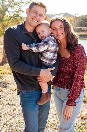 Happy family portrait: parents and baby