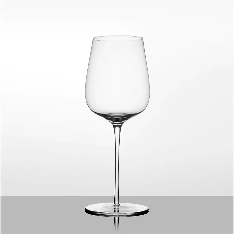 Close-up view of a Glas Vin All Purpose wine glass on a wooden tasting room table