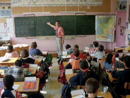 Teacher teaching children in a classroom