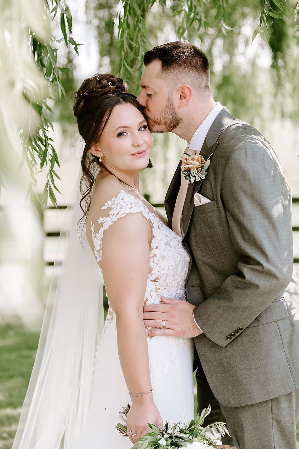 Bride and groom portraits in the gardens at Crockwell Farm surrounded by summer greenery