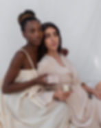 Two Models Holding Gazelle Skin Touch Face Cream and Box - Plant-Based Skincare