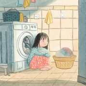 Young girl sitting on a bathroom floor watching laundry spin inside a washing machine.