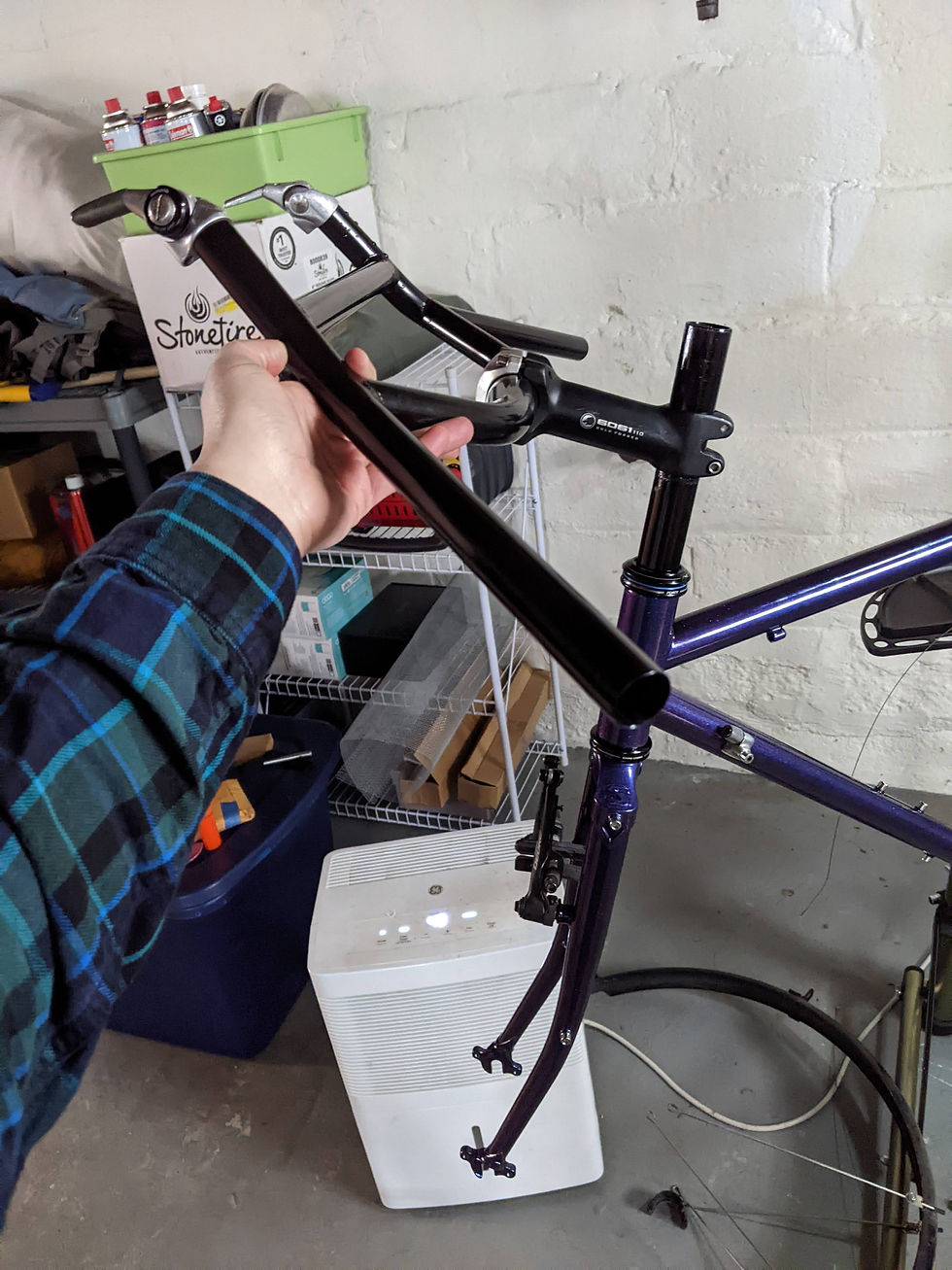 Moloko bars clamped onto the stem with bar-end shifters attached to the bull-horn ends.