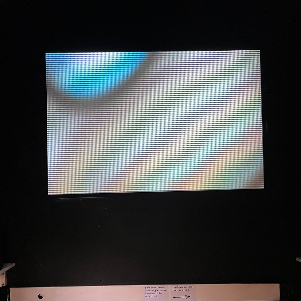 Generative video installation alwaysOn projected in a dark gallery at Summerhall, showing shifting patterns of light and colour