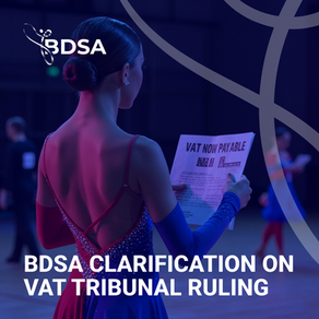 News article cover image of a young female dancer reading a notice regarding VAT