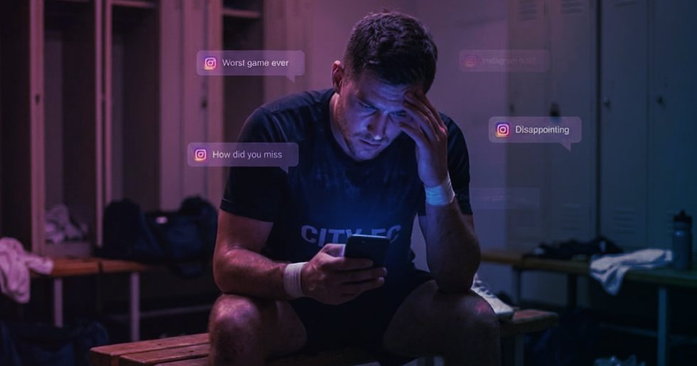 Athlete reading social media posts on his phone after the game.