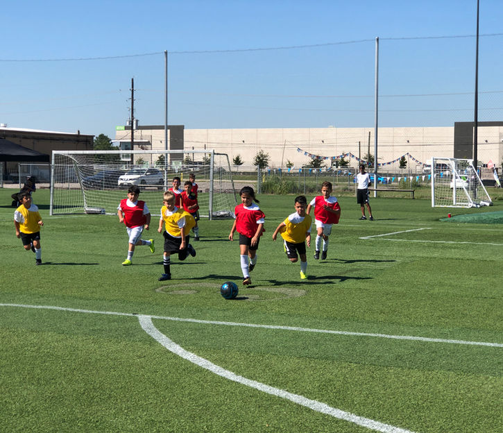 PLAYING SOCCER OUTDOOR