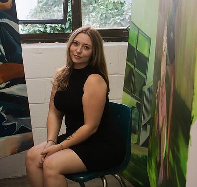 Curriculum Coordinator Simone F. with her art work
