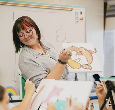 Owner Asia Di Antonio teaching an art class