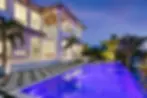 luxury-waterfront-home-poolside-twilight