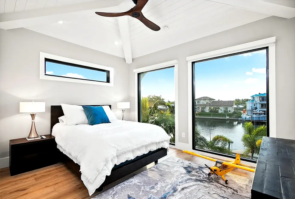coastal-bedroom-large-windows-canal-view