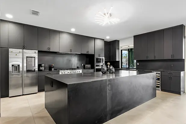 wide-angle-black-cabinetry-modern-kitchen.webp