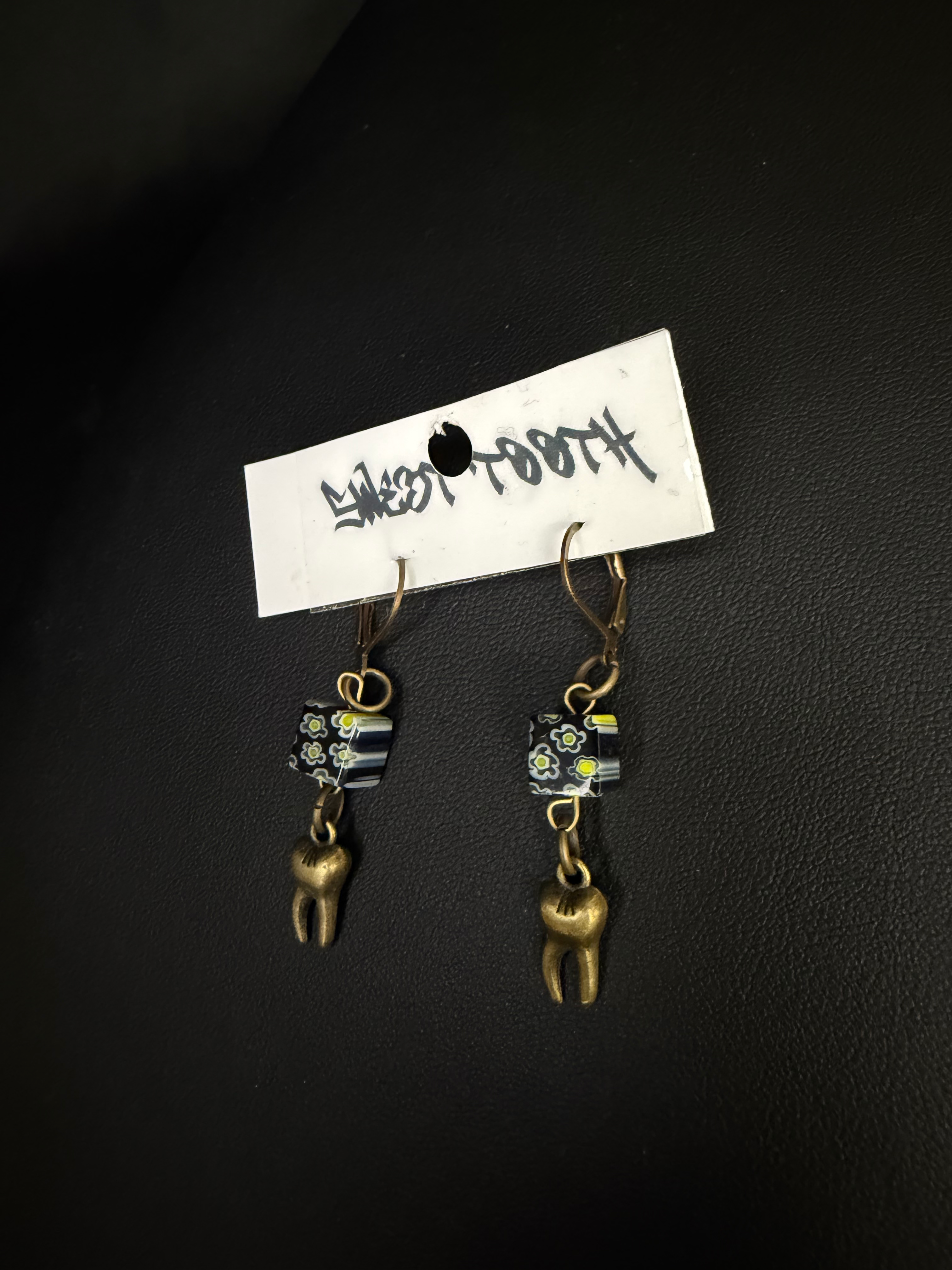 Brass tooth earring with floral beads