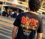 gemini-image-2_put_this_shirt_on_a_guy_that_looks_like_he_is_an_ac_dc_fan_from_brazil_in_f