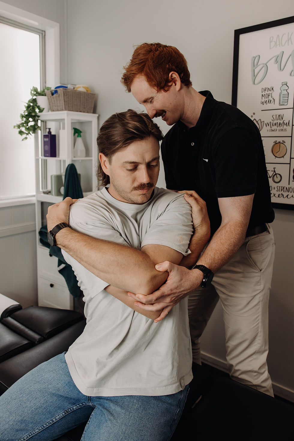 Sarina chiropractor adjusting a patient's mid-back