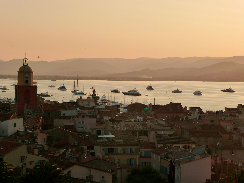 A breathtaking sunset over the village of Saint-Tropez, with the Gulf of Saint-Tropez and