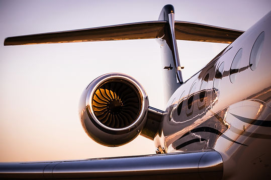 a limousine chauffeur waiting for clients at the Saint-Tropez business aviation airport