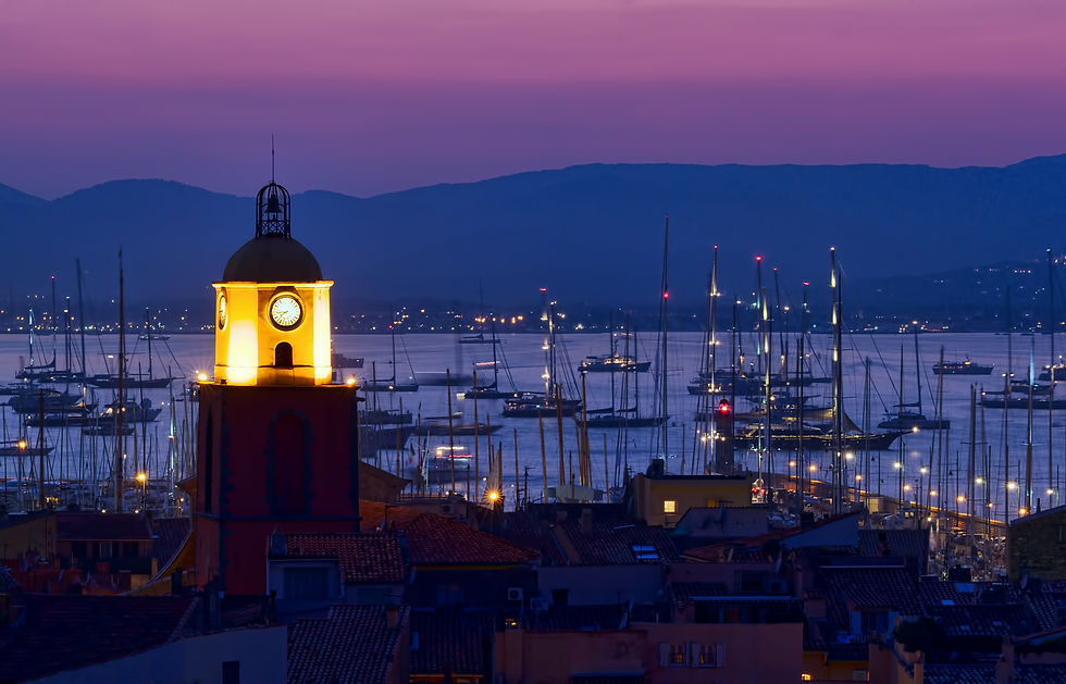 A view of the Gulf of Saint-Tropez with the Saint-Tropez bell tower at night.